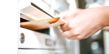 Person putting something in the mail