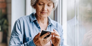 woman looking at her phone getting information on life after separation