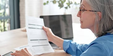 women reviewing paperwork related to her retirement account