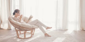 woman relaxing with tea and reading 