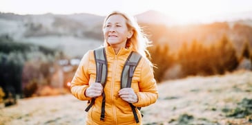 woman out for a hike as part of her emotional first-aid kit during divorce