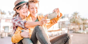 Two women take a selfie while on a date
