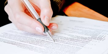 person filling out divorce paperwork