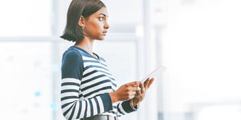 young Indian woman holding a mobile phone