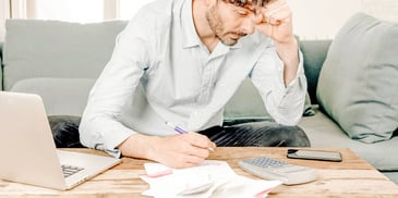 Man looks over his financial disclosures for divorce