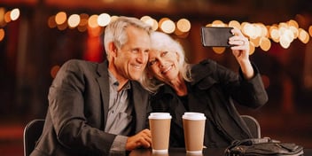smiling white hair couple on the town
