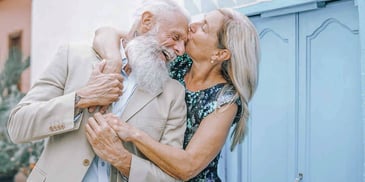 happy older couple embracing