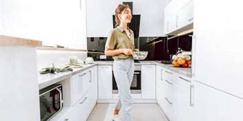 woman in kitchen making a nutritious meal