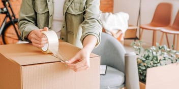woman packing and moving