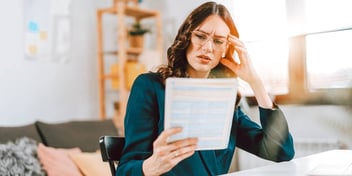 woman reading paperwork