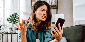 angry woman shouting at her phone