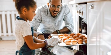 father is proud of his daughter who baked muffins from scratch