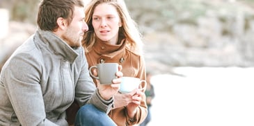 young couple having a serious talk over coffee