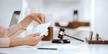 person looking at paperwork in a legal setting