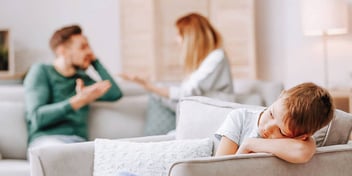 parents argue about mediation while child is sad