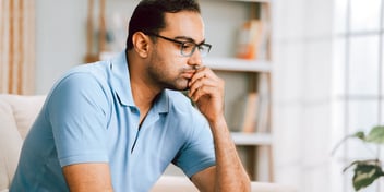 indian man looking pensive