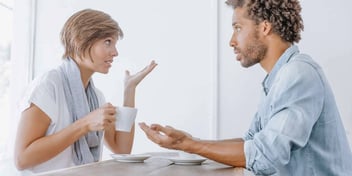 Woman and man have an intense conversation about their divorce