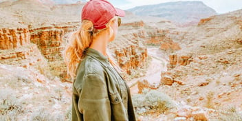woman taking a hike in a canyon