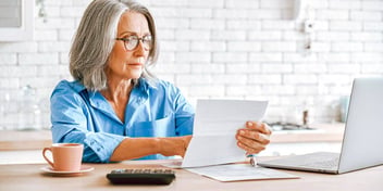 woman reviewing financial account statements
