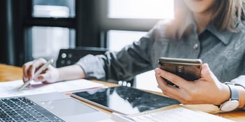 person calculating and filling out divorce financial disclosures